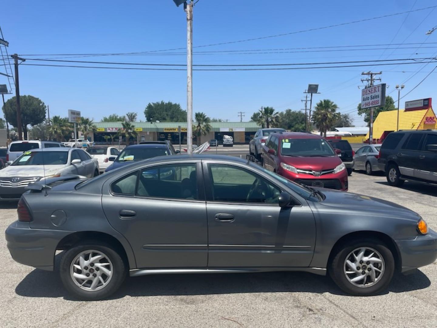 2003 Pontiac Grand AM SE sedan (1G2NE52F33C) with an 2.2L L4 DOHC 16V engine, located at 44356 Date Ave., Lancaster, CA, 93534, (661) 945-6555, 34.688919, -118.139374 - Photo#2