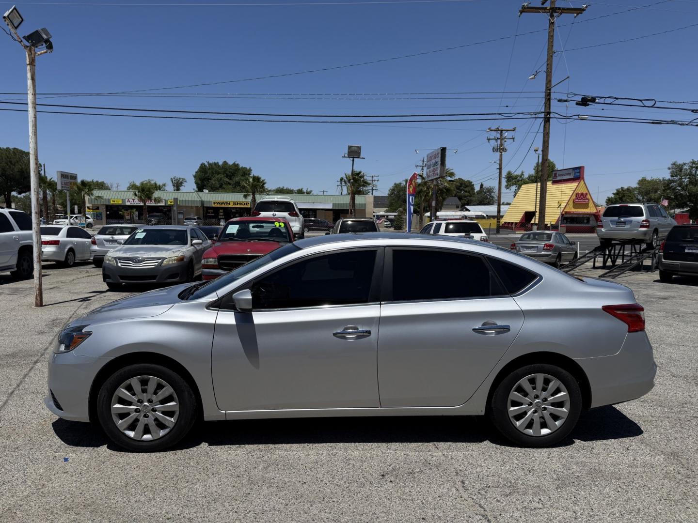 2016 Nissan Sentra FE+ S (3N1AB7AP8GY) with an 1.8L L4 SFI DOHC 16V engine, CVT transmission, located at 44356 Date Ave., Lancaster, CA, 93534, (661) 945-6555, 34.688919, -118.139374 - Photo#2