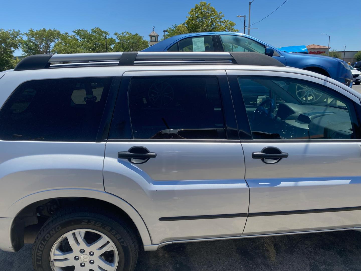 2005 Mitsubishi Endeavor LS AWD (4A4MN21S95E) with an 3.8L V6 SOHC 24V engine, 4-Speed Automatic Overdrive transmission, located at 44356 Date Ave., Lancaster, CA, 93534, (661) 945-6555, 34.688919, -118.139374 - Photo#2